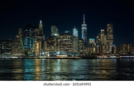 Panoramic view of Manhattan skyscrapers at night, at Christmas, from the Dumbo area in Brooklyn - Shutterstock ID 1031693992