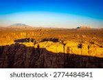 Panoramic view of Marble Canyon cliffs and Colorado River under warm sunset light from Spencer Trail Lookout