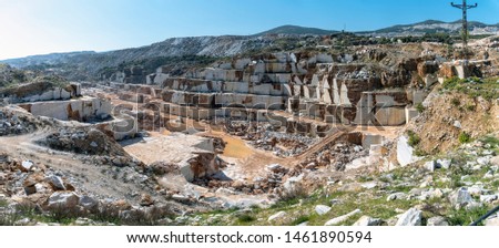 Panoramic view of marble quarry pit full of rocks and blocks in Marmara island, Balikesir, Turkey