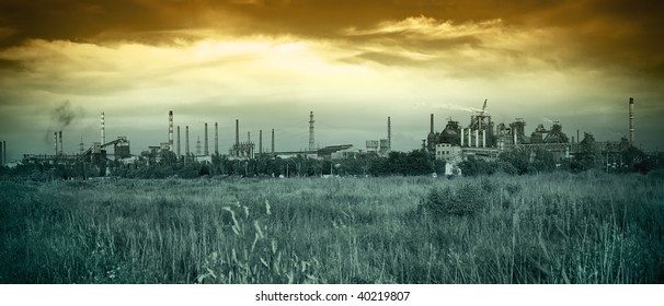 panoramic view of metallurgical works with smog