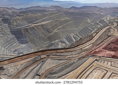 Panoramic view of mining roads next to a huge open pit for copper extraction
