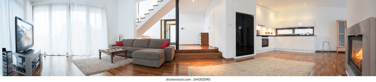 Panoramic view of modern interior with living room and kitchen - Shutterstock ID 244302040
