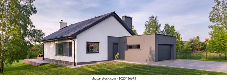 Panoramic View Of Modern One-story House With Garage And Sliding Roof