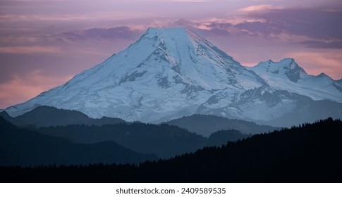 Panoramic view of Mount baker in Washington state as seen from Victoria British Columbia Canada before sunset. Snow-capped mountains. Snow Mountain. Travel photo, copy space, nobody
