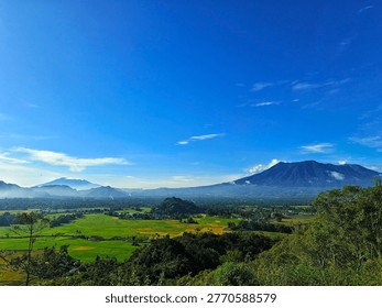Panoramic View of Mount Marapi and Mount Sago Over Agam Rice Valley and Bukittinggi, West Sumatra — Lush Terraces, Misty Volcanoes, Minangkabau Heritage Landscape