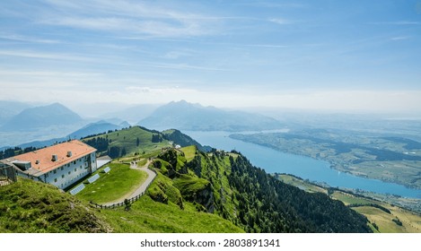 Panoramic view from mount rigi displaying lake lucerne with mountains and green landscape