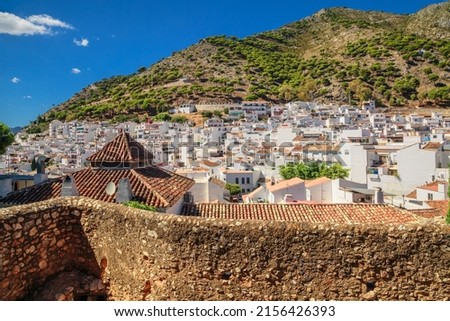 panoramic view of a mountain and Mijas, a small touristyc white-washed village at Malaga province. Andalusia, Spain