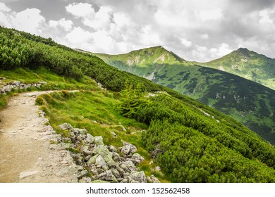 Panoramic View Of Mountain Peaks From The Trail