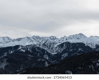 Panoramic view of mountain range covered in snow.
