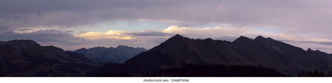 panoramic view of a mountain range at sunset