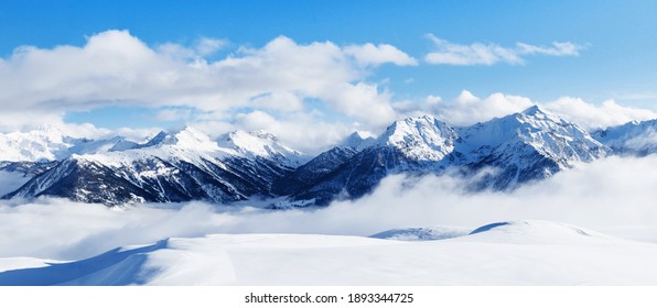 Panoramic view of mountains near Brianson, Serre Chevalier resort, France. Ski resort landscape on clear sunny day. Mountain ski resort. Snow slope. Snowy mountains. Winter vacation. Panorama, banner. - Powered by Shutterstock