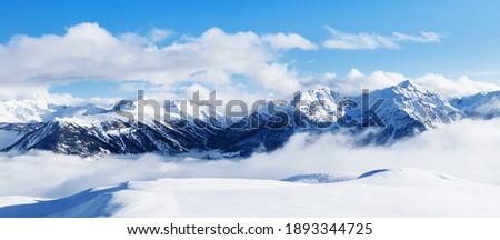 Panoramic view of mountains near Brianson, Serre Chevalier resort, France. Ski resort landscape on clear sunny day. Mountain ski resort. Snow slope. Snowy mountains. Winter vacation. Panorama, banner.