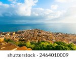 Panoramic view of Naples city and Gulf of Naples, Italy. Blue sea and the sky with clouds at sunset. Famous travel destination.