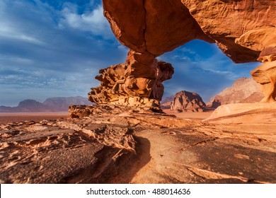 Panoramic view of natural rock bridge and Wadi Rum desert, Jordan