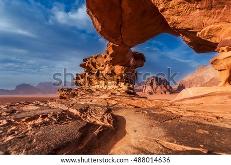 Panoramic view of natural rock bridge and Wadi Rum desert, Jordan