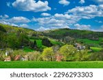 A panoramic view of the Neunkircher Höhe in the Odenwald area in Germany, on a sunny springday, with clouds in the sky