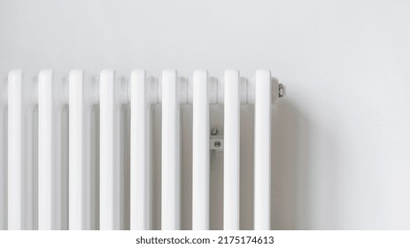 Panoramic View Of New Metal Radiator In Central Heating System At Home Hanging On White Wall In Modern Apartment. Household Equipment, Energy Supply, Consumption And Utility Bill Concept