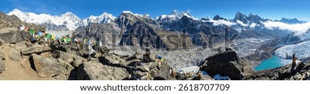 Panoramic view of Ngozumba glacier and great himalayan range, Mount Everest, Lhotse Cho Oyu and Makalu, Gokyo lake and village, prayer flags, from Gokyo Ri, three passes trek Nepal Himalaya mountain