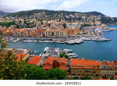 Panoramic view of Nice (Cote d'Azur, France) with harbor, yachts and beautiful buildings. View from above