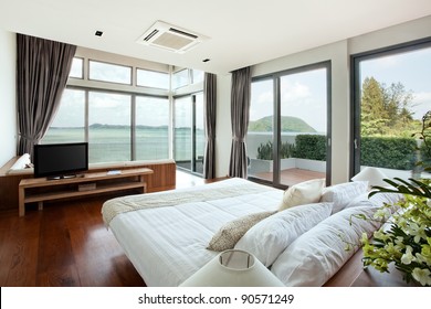 panoramic view of nice cozy  bedroom  with  summer  outdoor.