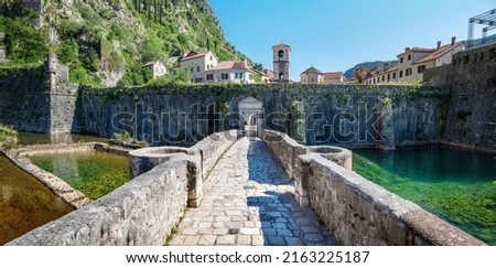 Panoramic view of nord river gate, ancient fortress and church of St. Mary in Old Town of Kotor. Kotor, Montenegro.