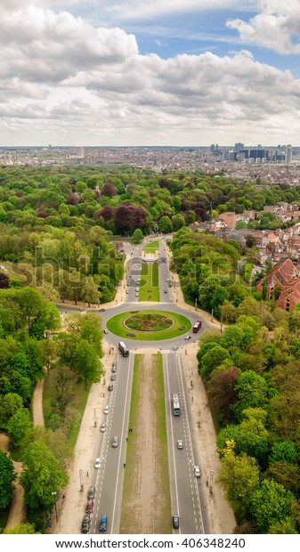 Panoramic view from\
the observation deck to the cityscape - the green trees, modern and\
historic buildings, road and cars near miniature park \
