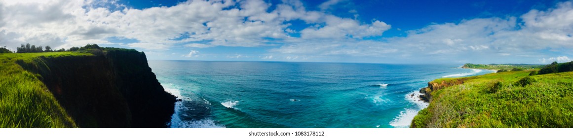 Panoramic view of the ocean from a grass cliff top