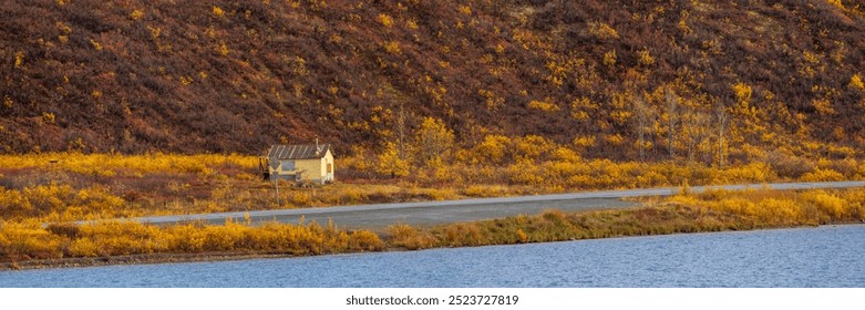 Panoramic view of old abandoned hut along the Richardson highway in Alaska with colorful foliage. - Powered by Shutterstock