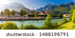 Panoramic view of Old City with thrain station and Aare river. Interlaken, important tourist center in the Bernese Highlands, Switzerland. The Jungfrau is visible in the background