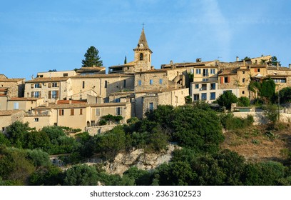 Panoramic view of old constructions surrounded with greenery in Montfort commune, France