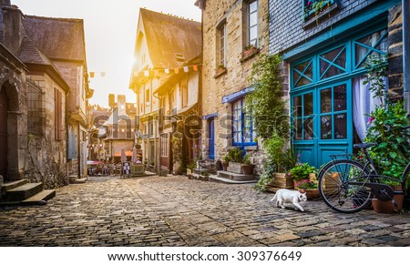 Panoramic view of old town in Europe in beautiful evening light at sunset with retro vintage Instagram style grunge filter and lens flare effect
