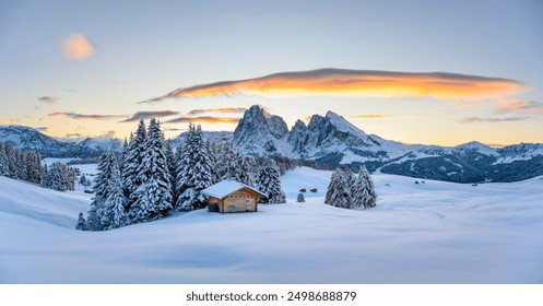 Panoramic view on Alpe di Siusi meadow with small wooden log cabin and first snow. Snowy hills with orange larch and Sassolungo and Langkofel mountains group. Seiser Alm, Dolomites, Italy. - Powered by Shutterstock