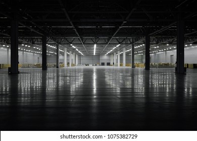 Panoramic View On Empty Pavilion Hall Under Construction, With Dark Front And Light On The Back Wall, Floor Reflection. Interior Metal Construction. Industrial Warehouse Hall. Darkness To Light