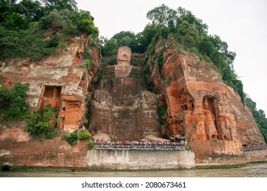 Panoramic view on The Giant Buddha of Leshan from the river, Leshan, Sichuan, China. UNESCO World Heritage site. Focus on the face
