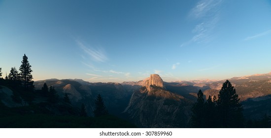 Panoramic view on Half Dome peak in sunset light from Glacier Point trailhead. Sierra Nevada mountains, Yosemite National Park, California