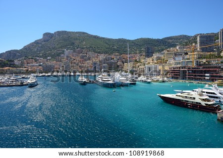 Panoramic view on marina with yachts and residential buildings in Monte Carlo, Monaco.