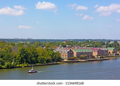 A panoramic view on Old Town Alexandria from the Potomac River in Virginia, USA. A river waterfront along the river of nationally designated historic district in early fall.