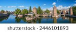 Panoramic view on The Ponts Couverts in Strasbourg with blue cloudy sky. France. 