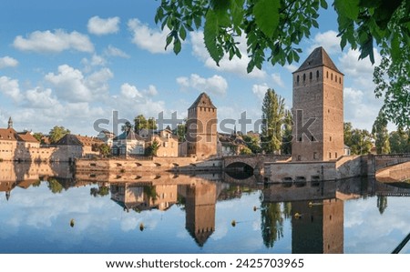 Panoramic view on The Ponts Couverts in Strasbourg with blue cloudy sky. France. 