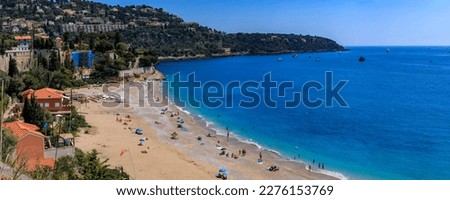 Panoramic view onto Roquebrune Cap Martin peninsula and beach near Monaco with the turquoise water of the Mediterranean Sea, South of France