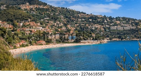 Panoramic view onto Roquebrune Cap Martin peninsula and beach near Monaco with the turquoise water of the Mediterranean Sea, South of France