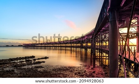 Panoramic view of the ore loading dock of the Rio Tinto mining company in Huelva, Andalusia, Spain. Sunset at the Muelle del Tinto