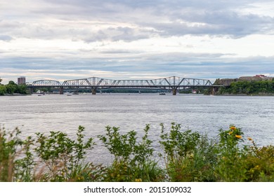 Panoramic view of Ottawa River and Alexandra Bridge from Ottawa to Gatineau city of Quebec, Canada in summer evening