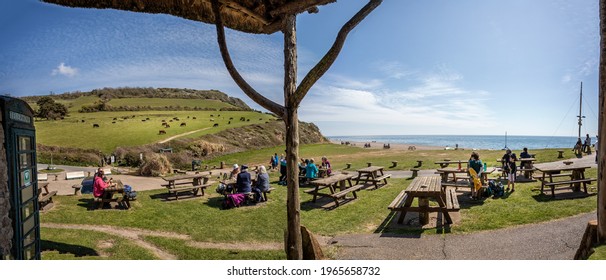 Panoramic View Of Outdoor Dining At Sea Shanty Cafe On The Beach At Brasncombe, Devon, UK On 19 April 2021