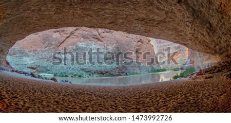 A panoramic view outward from Redwall Cavern, a large alcove in the Redwall limestone layer along the Colorado river in Grand Canyon National Park, Arizona