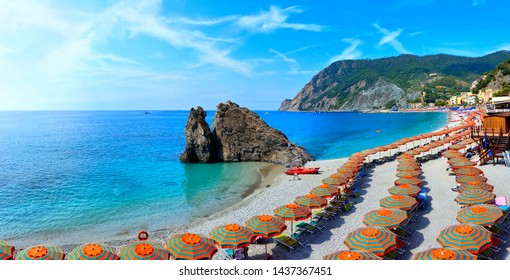 Panoramic View Over Colorful Umbrellas At A Beach In The Cinque Terre Village Of Monterosso