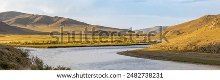 Panoramic view over the Herlen River, West Mongolia, in the evening light