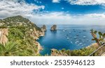 Panoramic view over Marina Piccola and Faraglioni: coastal wonders in Mediterranean splendor of the island of Capri, Italy