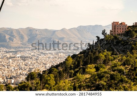 Panoramic view of Palermo cityscape and distant mountains from Monte Pellegrino with Castle Utveggio on the hilltop