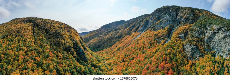 Panoramic view of peak fall foliage in Smugglers Notch, Vermont. - Shutterstock ID 1878828076